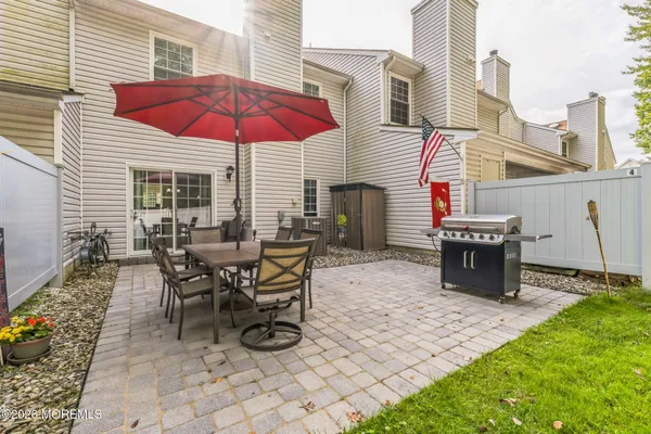 a view of a dinning table and chairs in the patio