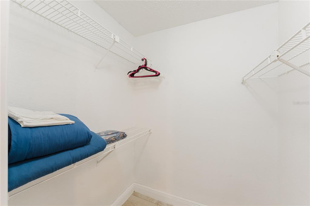 5120 Conroy Road, Unit 18 Orlando, FL 32811 - Photo 19 of 38 a view of storage and utility room with racks on the wall