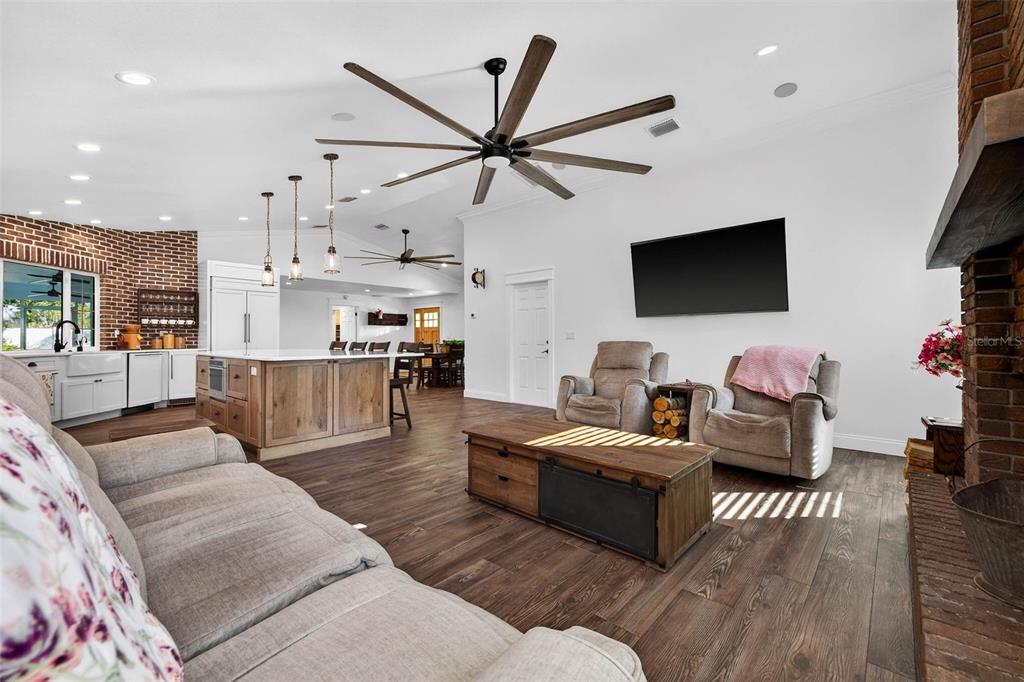 11945 74th Avenue Seminole, FL 33772 - Photo 14 of 47 a living room with furniture and a flat screen tv