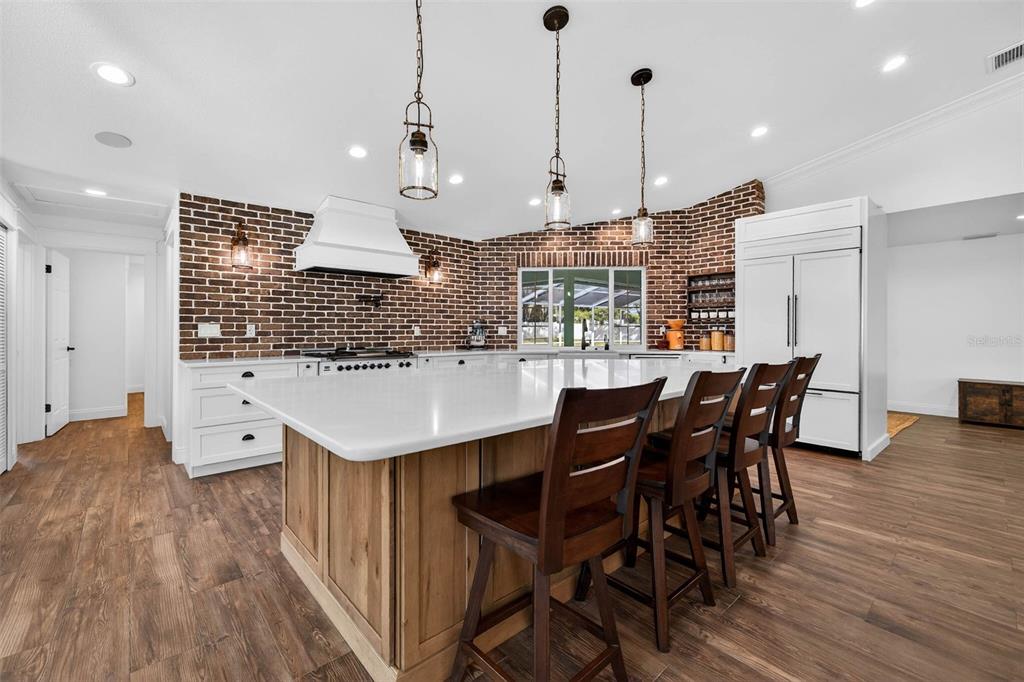 11945 74th Avenue Seminole, FL 33772 - Photo 18 of 47 a large kitchen with a table and chairs