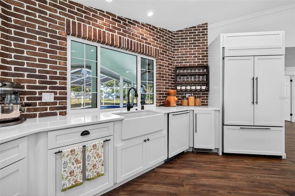 11945 74th Avenue Seminole, FL 33772 - Photo 22 of 47 a kitchen with windows and refrigerator