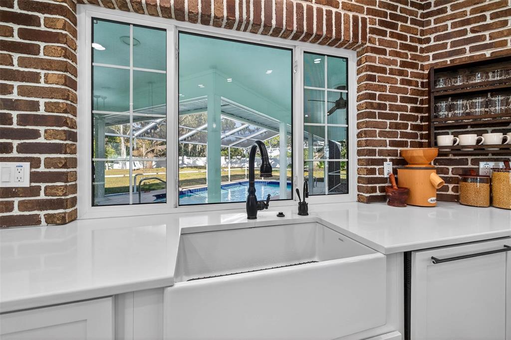11945 74th Avenue Seminole, FL 33772 - Photo 23 of 47 a kitchen with a sink and a large window
