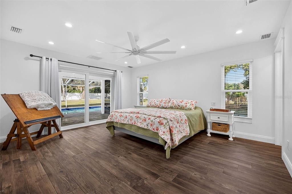 11945 74th Avenue Seminole, FL 33772 - Photo 27 of 47 a bedroom with a bed window and a table