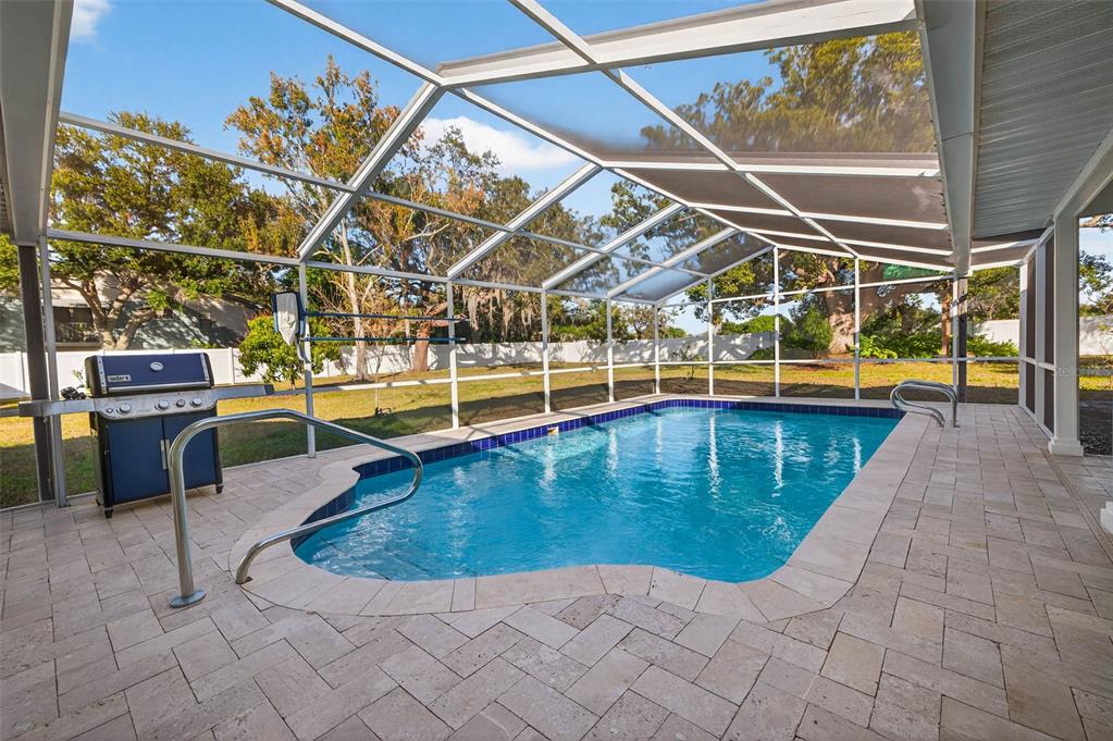 11945 74th Avenue Seminole, FL 33772 - Photo 32 of 47 a view of a swimming pool with lounge chair