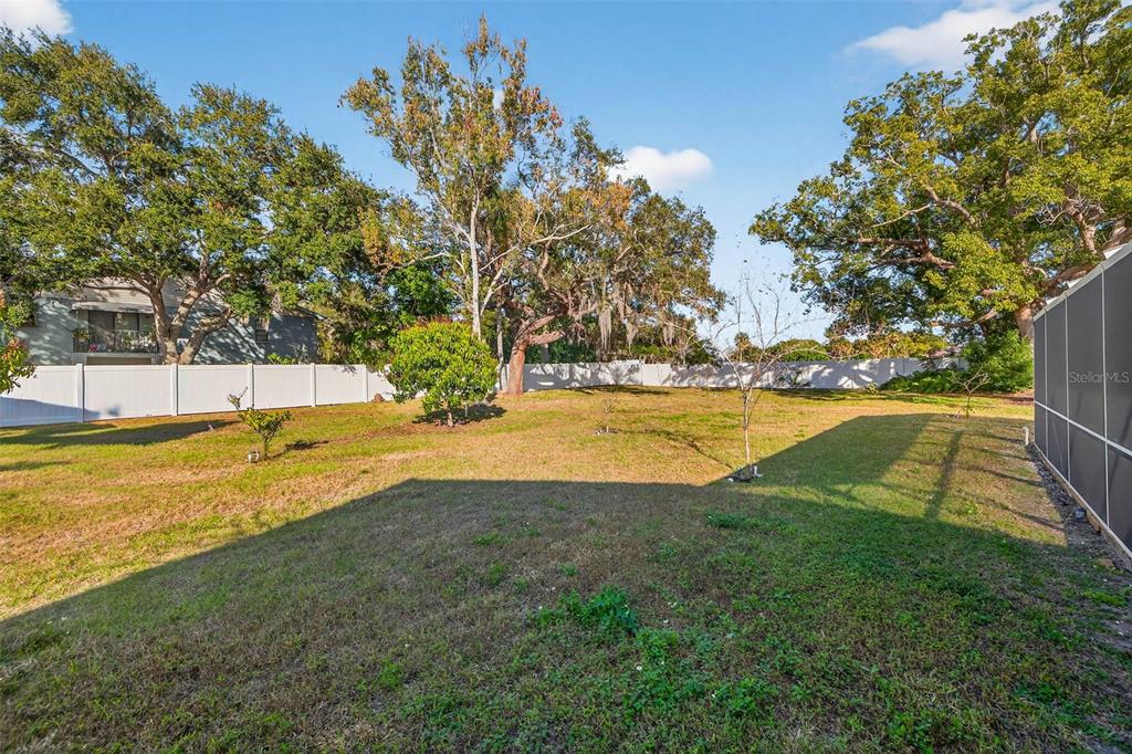 11945 74th Avenue Seminole, FL 33772 - Photo 36 of 47 a view of a swimming pool with an outdoor space and seating area