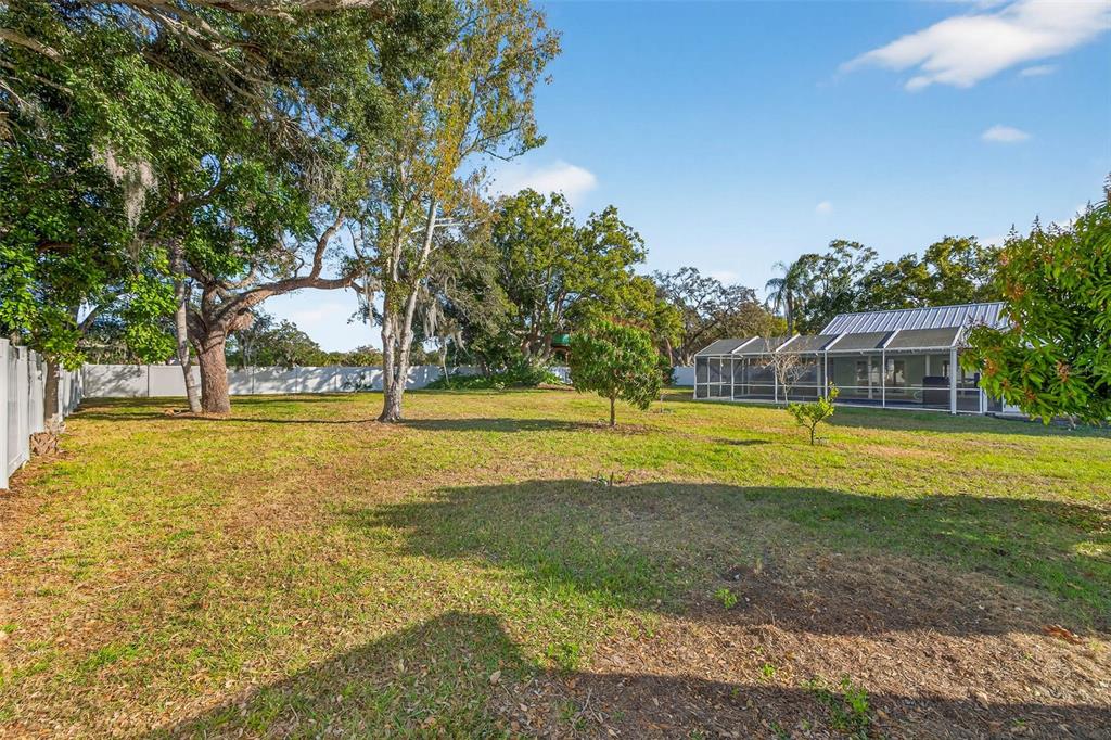 11945 74th Avenue Seminole, FL 33772 - Photo 37 of 47 a view of a swimming pool with an outdoor space and seating area