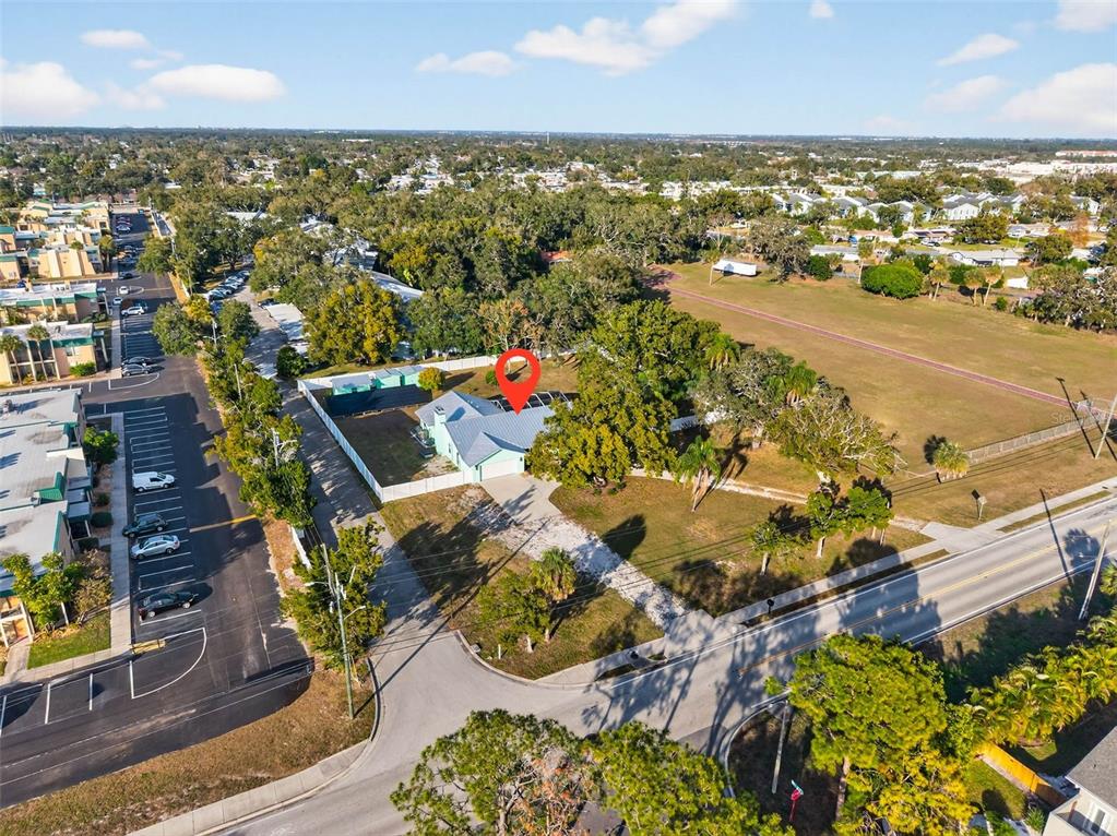 11945 74th Avenue Seminole, FL 33772 - Photo 40 of 47 an aerial view of residential houses with outdoor space