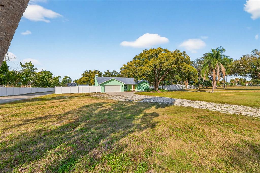 11945 74th Avenue Seminole, FL 33772 - Photo 4 of 47 a view of a swimming pool with an ocean view