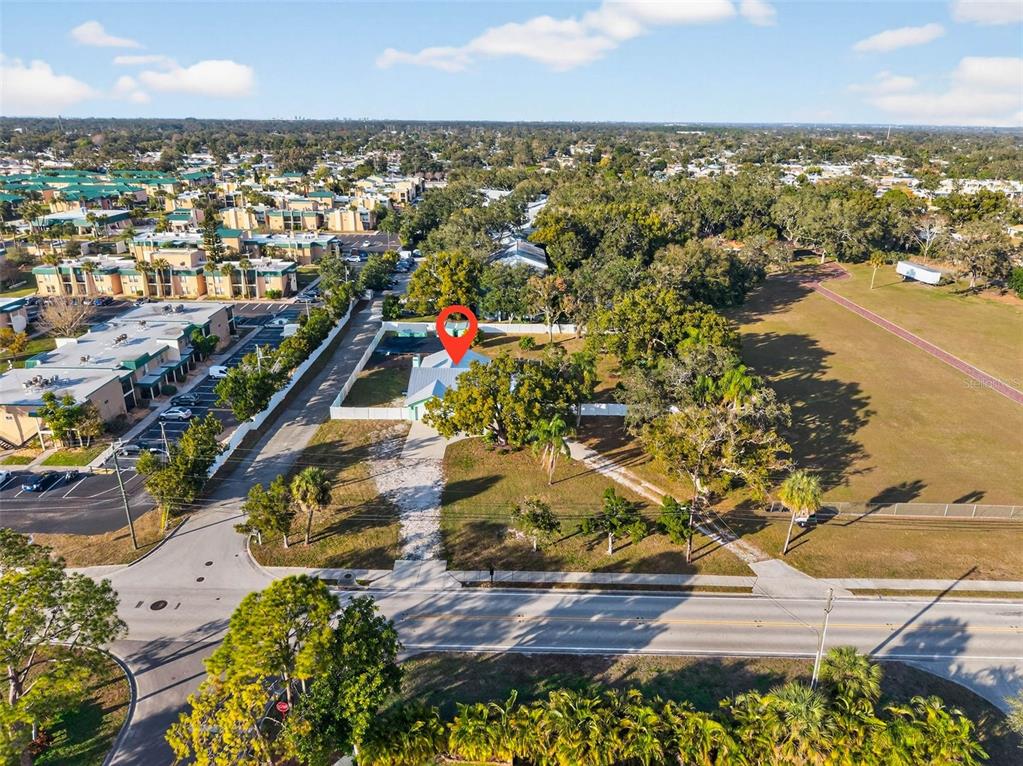11945 74th Avenue Seminole, FL 33772 - Photo 41 of 47 an aerial view of residential houses with outdoor space