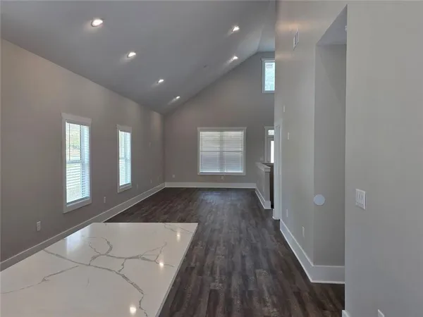 a view of empty room with windows