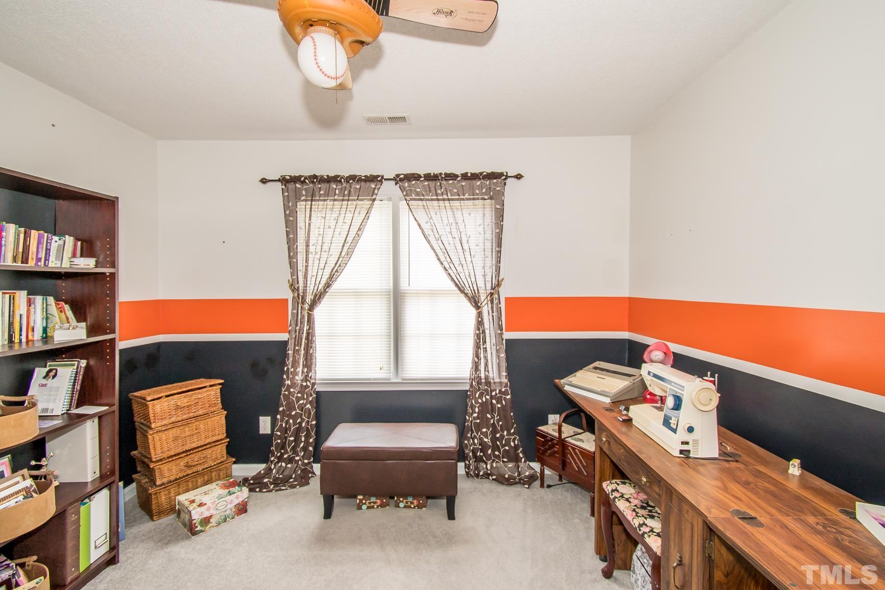 561 Yellow Berry Run Wendell, NC 27591 - Photo 27 of 27 a room with furniture and a window