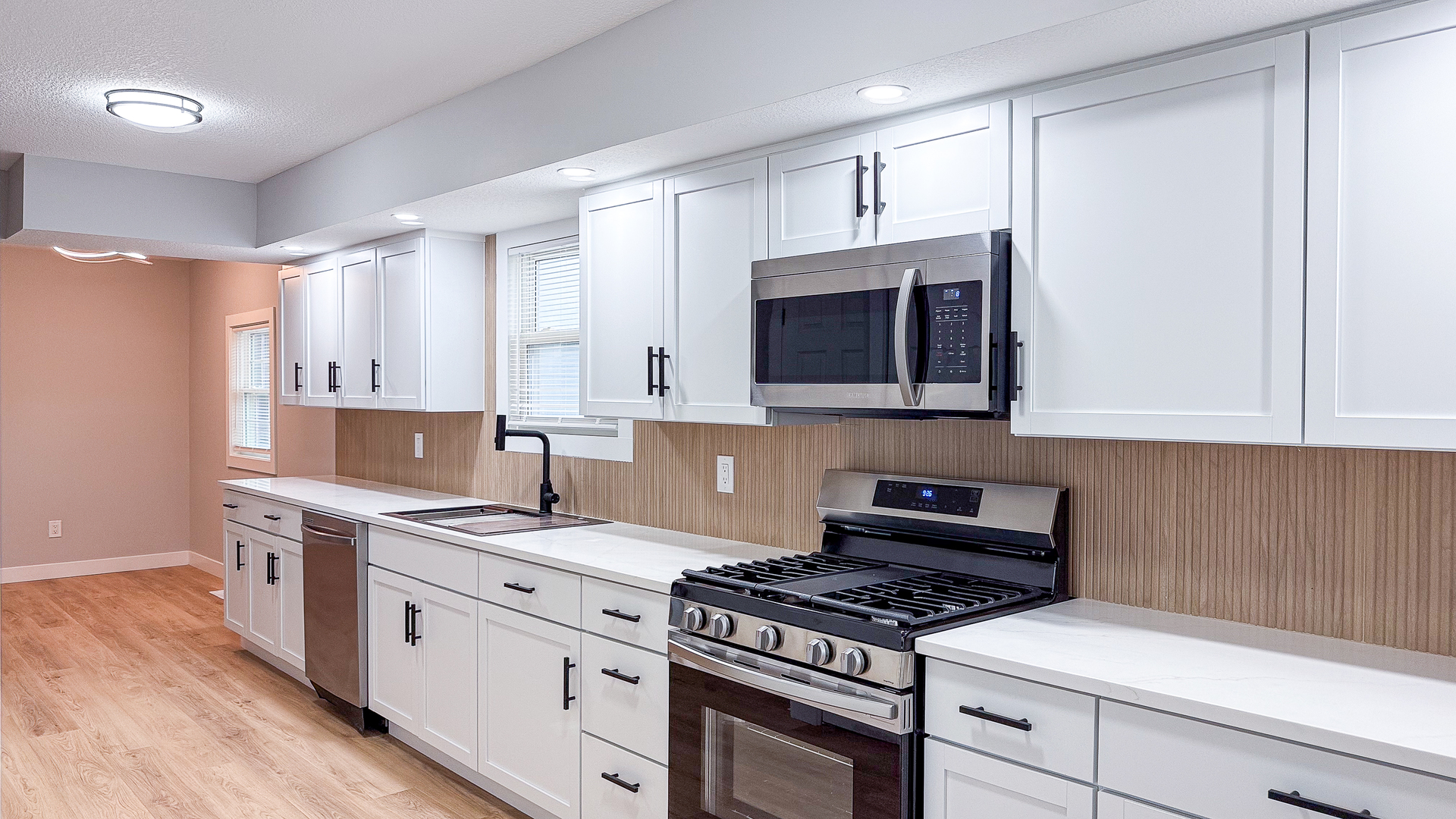 103 2nd Street Broadlands, IL 61816 - Photo 17 of 55 a kitchen with stainless steel appliances granite countertop a stove a sink and a microwave