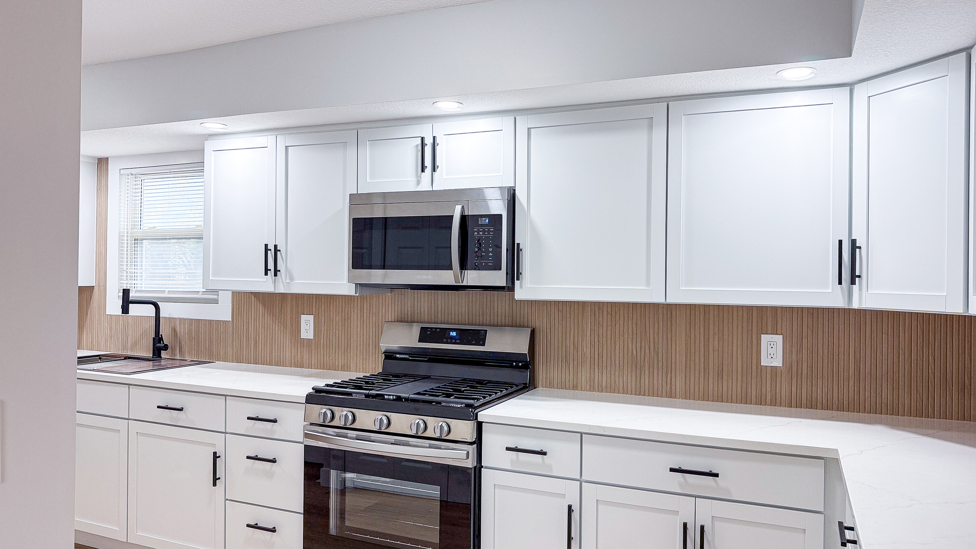 103 2nd Street Broadlands, IL 61816 - Photo 18 of 55 a kitchen with white cabinets and appliances