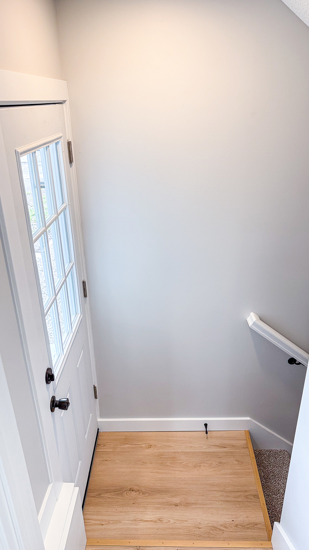 103 2nd Street Broadlands, IL 61816 - Photo 36 of 55 a view of a room with wooden floor and staircase
