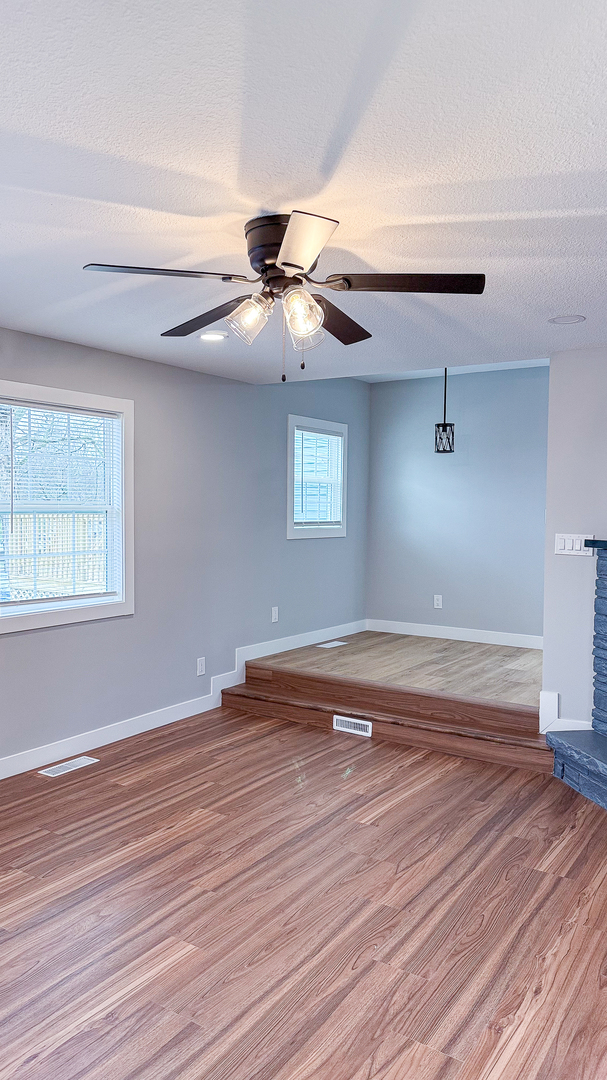 103 2nd Street Broadlands, IL 61816 - Photo 45 of 55 a view of an empty room with wooden floor and a window