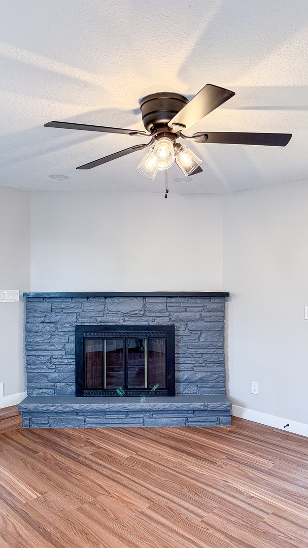 103 2nd Street Broadlands, IL 61816 - Photo 46 of 55 a view of a livingroom with a hall and a ceiling fan