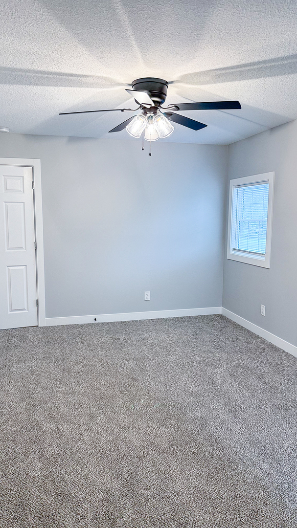 103 2nd Street Broadlands, IL 61816 - Photo 6 of 55 a view of a livingroom with a ceiling fan and window