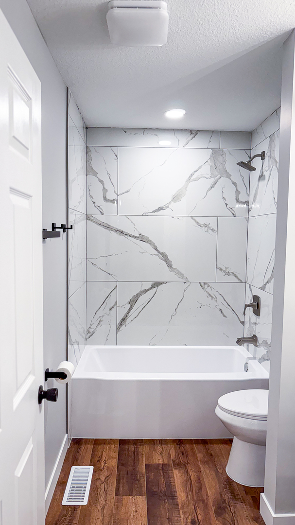 103 2nd Street Broadlands, IL 61816 - Photo 10 of 55 a bathroom with a toilet and a bathtub