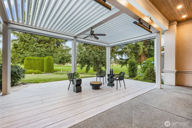 a view of a patio with chairs and plants