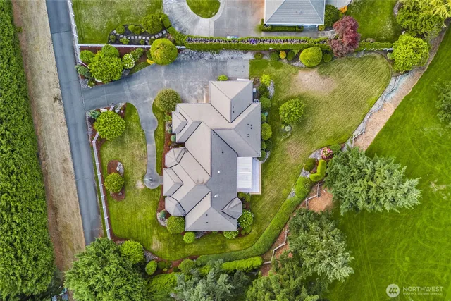 an aerial view of a house with a swimming pool