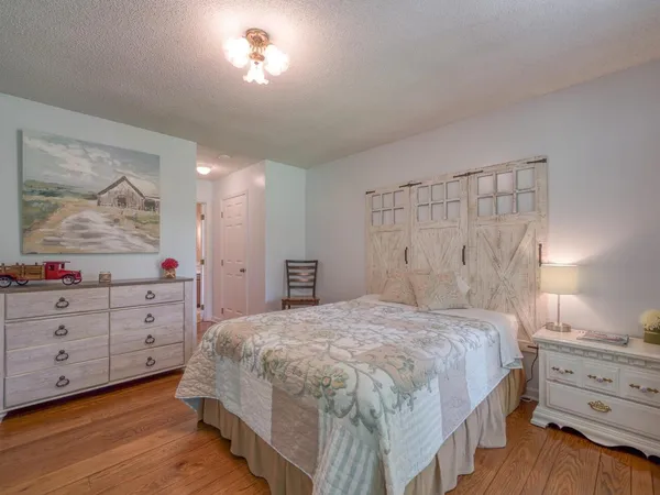 a bedroom with a bed and a dresser