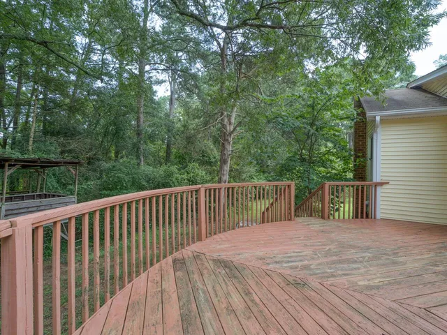 a view of a chairs and table in the balcony