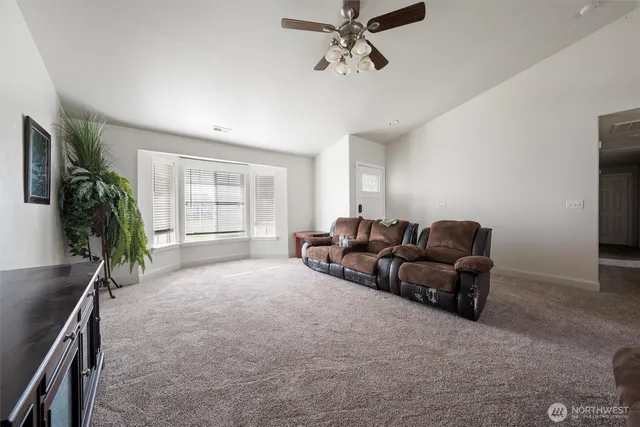 a living room with furniture and a window