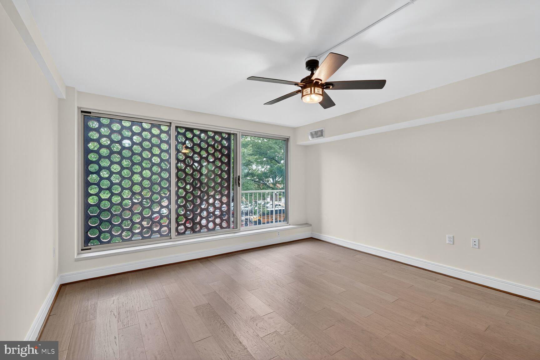 800 4th Street Southwest, Unit S221 Washington, DC 20024 - Photo 13 of 19 a view of room with hardwood floor and window