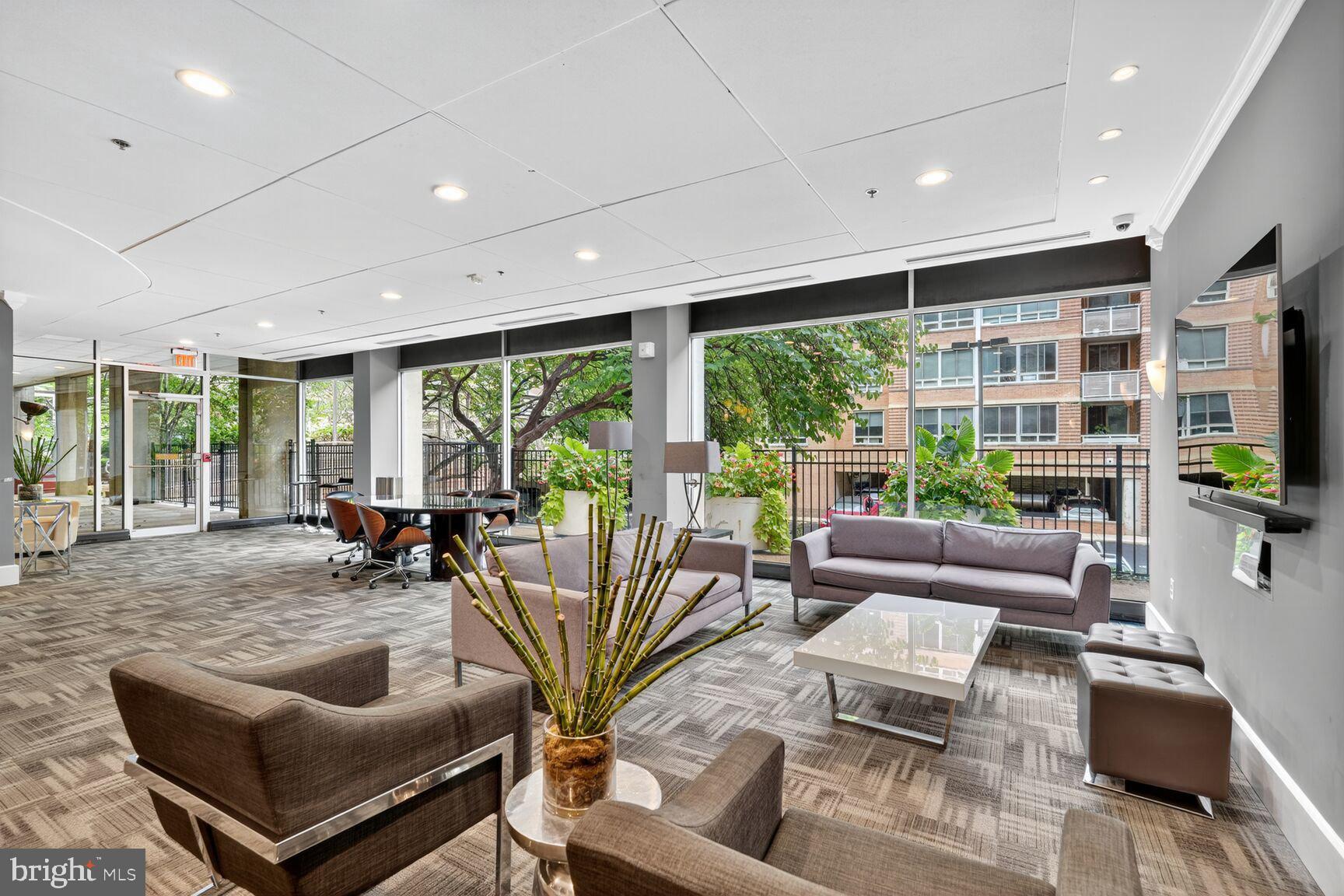 800 4th Street Southwest, Unit S221 Washington, DC 20024 - Photo 4 of 19 a living room with furniture and a floor to ceiling window