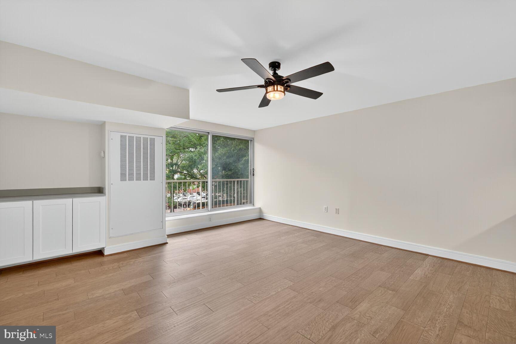 800 4th Street Southwest, Unit S221 Washington, DC 20024 - Photo 10 of 19 wooden floor in an empty room with a window