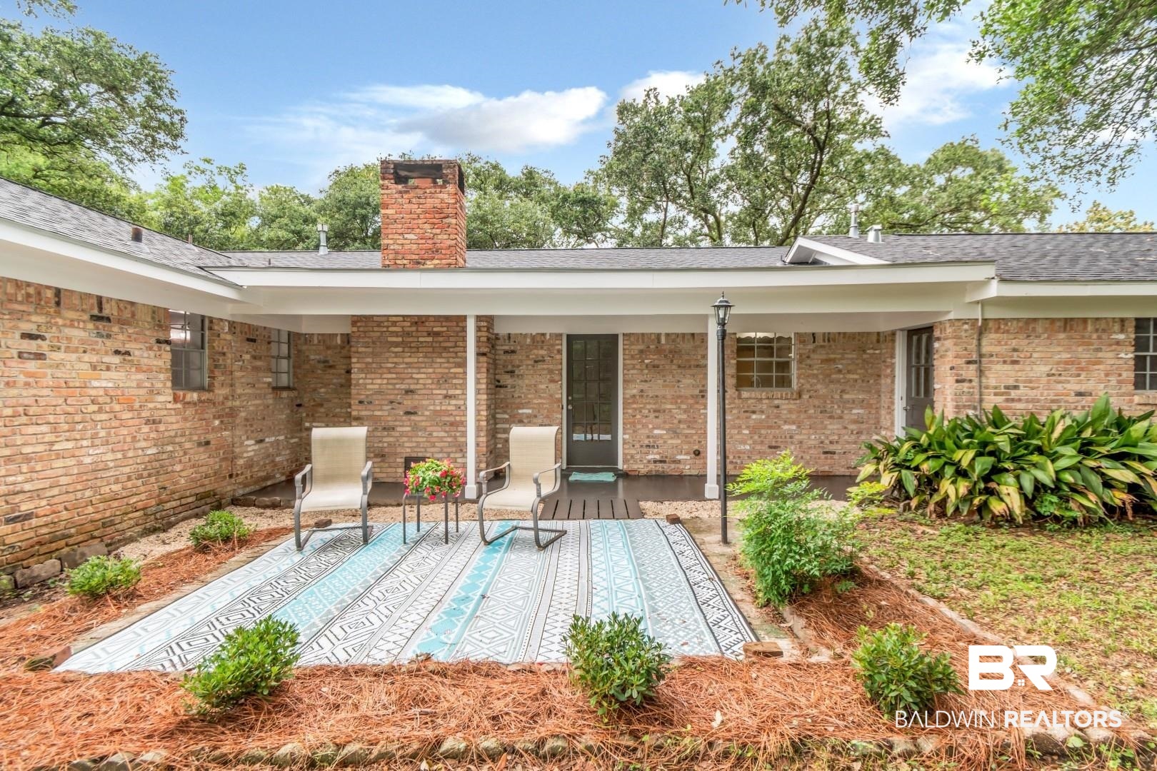 5217 Perin Road Mobile, AL 36693 - Photo 30 of 45 Covered patio area featuring a brick exterior and a paved surface