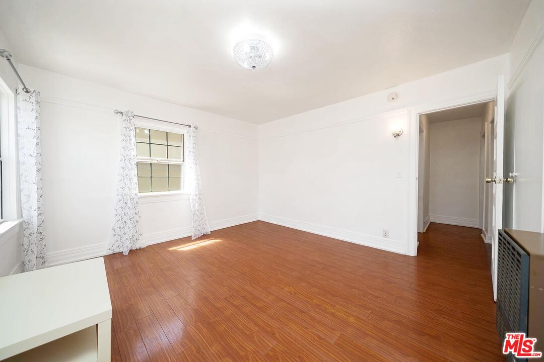 3714 West Pico Boulevard Los Angeles, CA 90019 - Photo 29 of 45 an empty room with wooden floor and windows