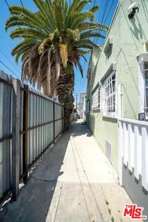 a view of a patio with table and chairs with wooden floor