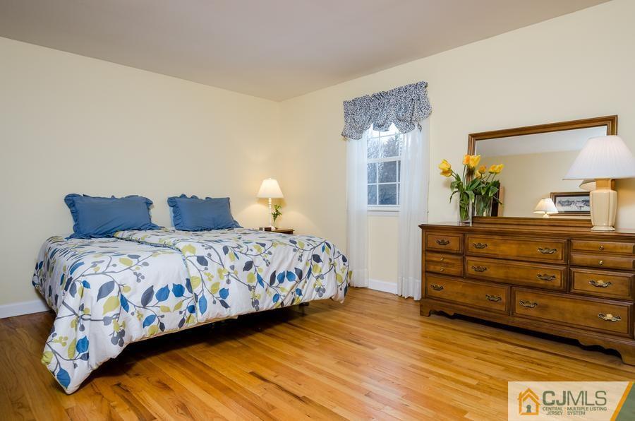 14 Fairfield Road Princeton, NJ 08540 - Photo 15 of 24 a bedroom with a bed and wooden floor
