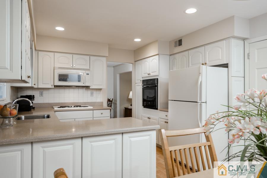 14 Fairfield Road Princeton, NJ 08540 - Photo 10 of 24 a kitchen with stainless steel appliances a refrigerator stove microwave and cabinets