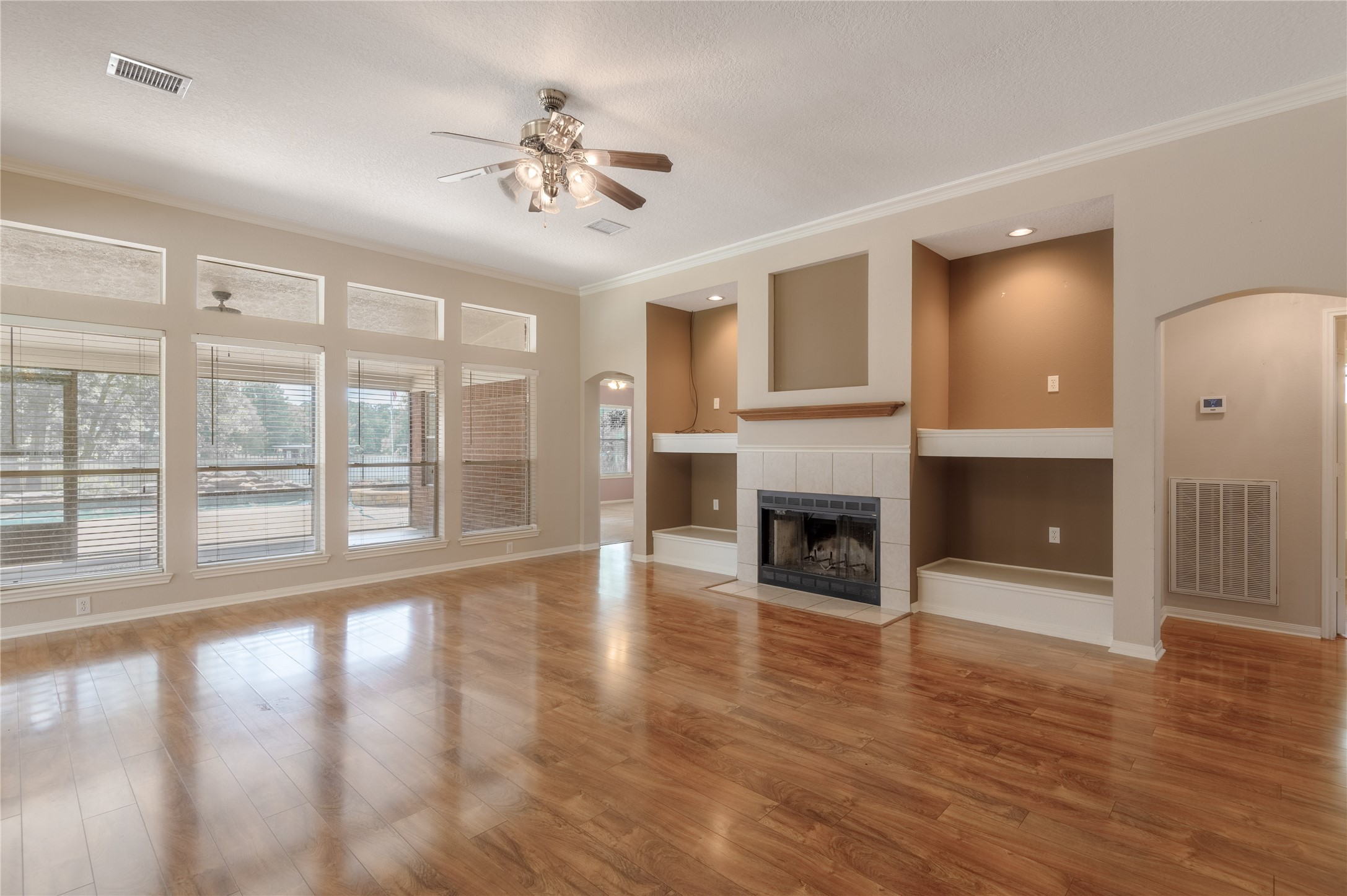 324 Red Oak Lane Trinity, TX 75862 - Photo 3 of 49 a view of an empty room with wooden floor and a fireplace