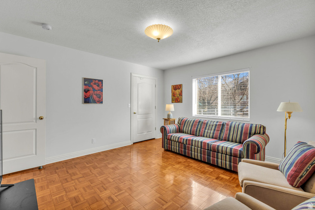 1060 West 2620th Street South Mapleton, UT 84664 - Photo 47 of 87 Living room with a textured ceiling and parquet floors