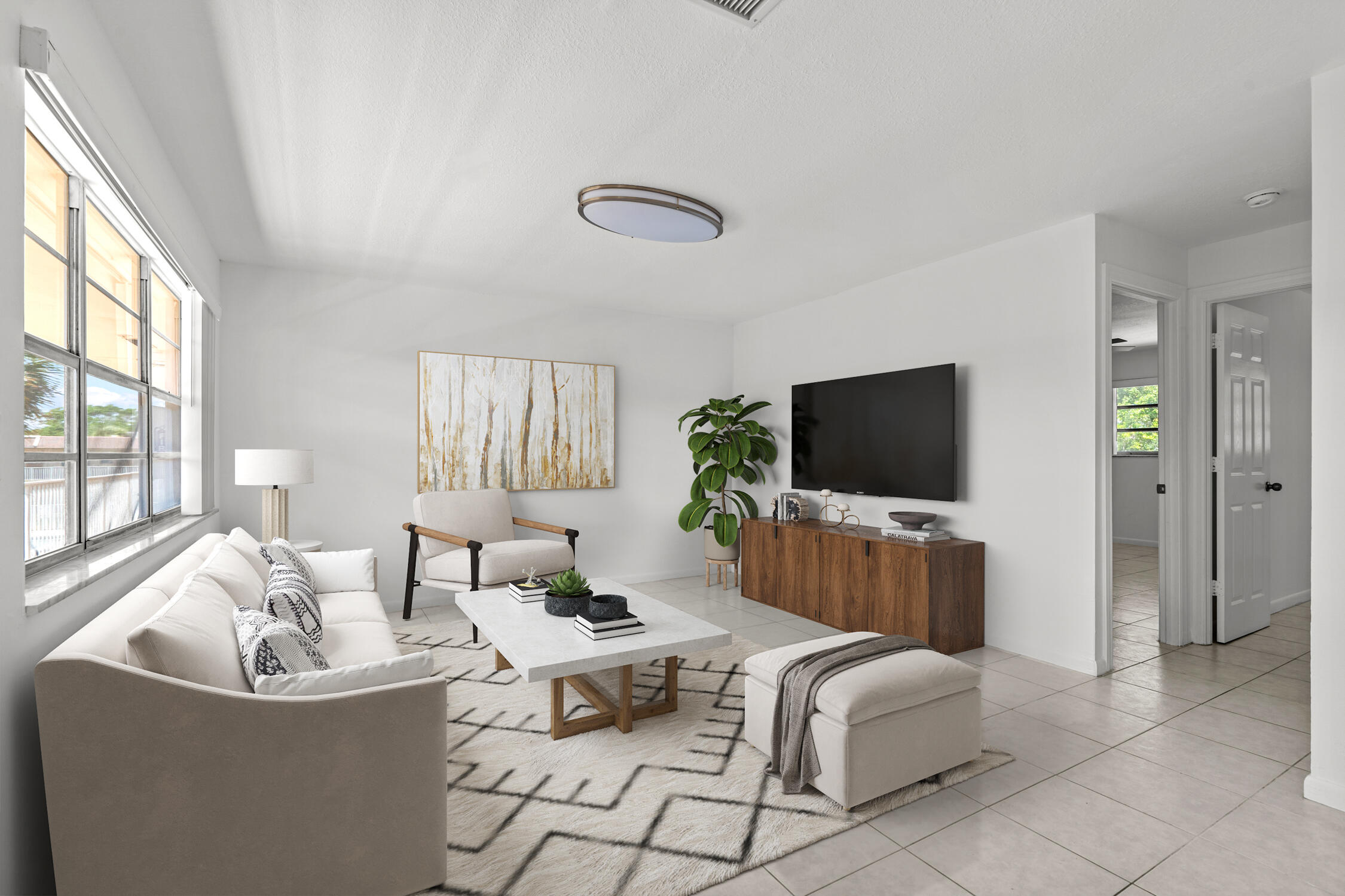 a living room with furniture and a flat screen tv