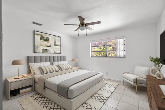 a bedroom with a bed and a couch