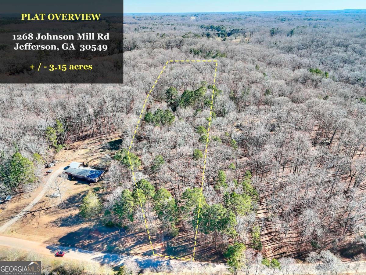 1268 Johnson Mill Road Jefferson, GA 30549 - Photo 19 of 28 a sign that is sitting in front of a field
