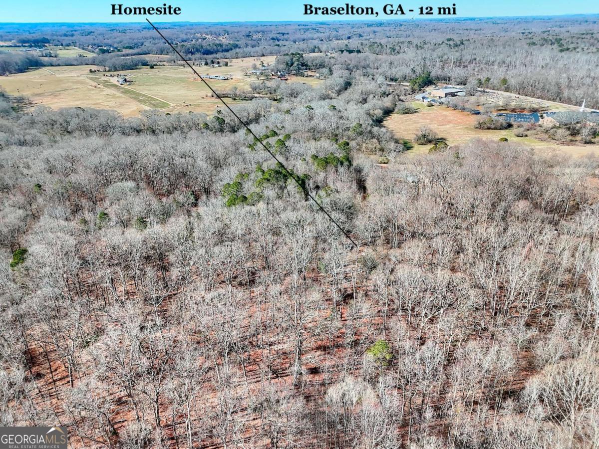 1268 Johnson Mill Road Jefferson, GA 30549 - Photo 24 of 28 a view of a dry yard with wooden fence