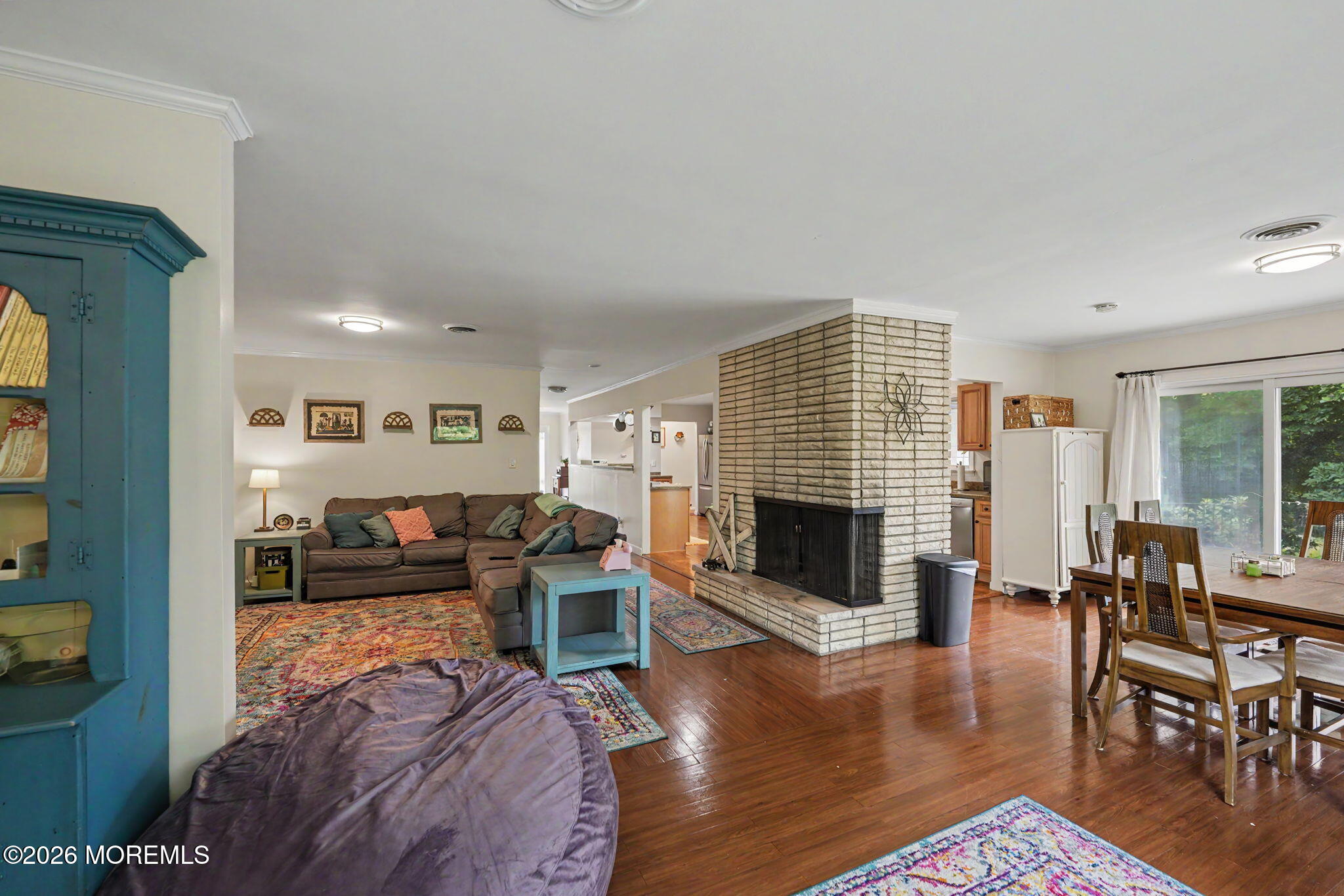 699 Aldrich Road Howell, NJ 07731 - Photo 3 of 30 a living room with furniture flat screen tv and a fireplace