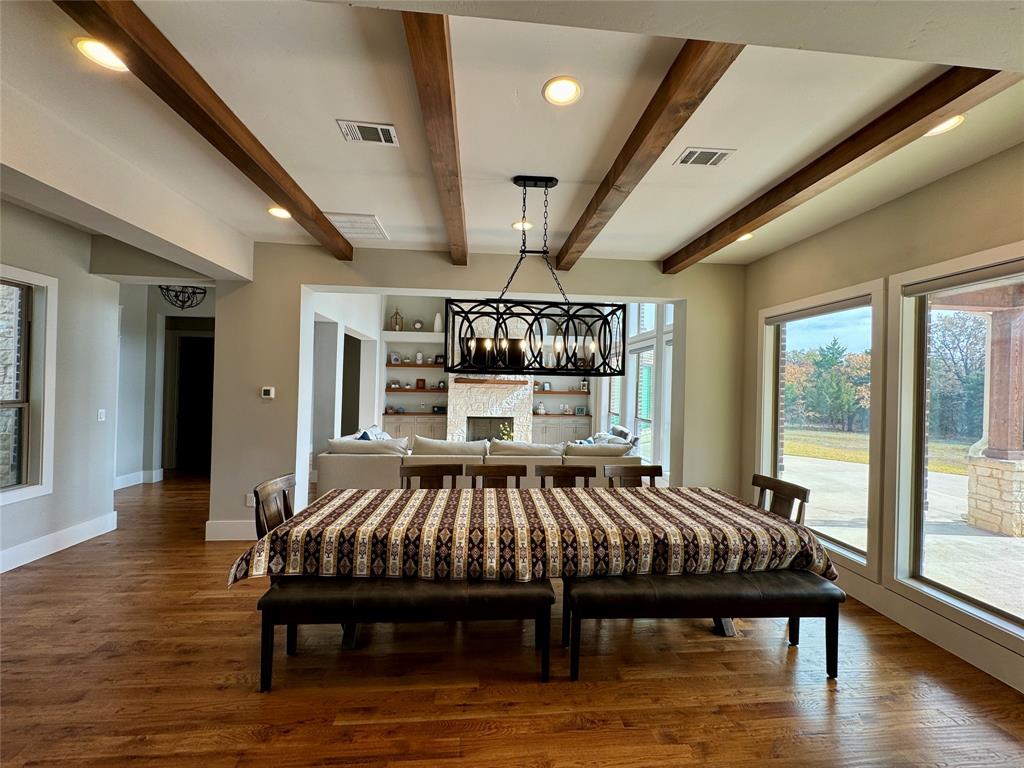 474 Eagle Cove Circle Tioga, TX 76271 - Photo 5 of 25 a bed sitting in a spacious bedroom next to a window