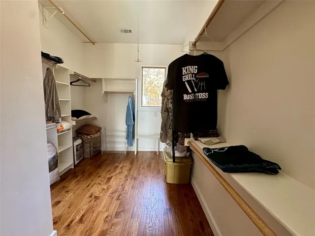 a kitchen with a sink appliances and cabinets