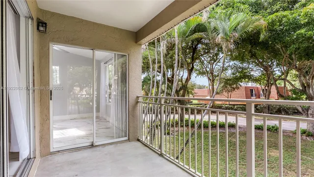 a view of balcony with small garden