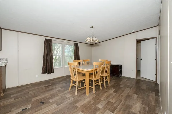 a view of a dining room with furniture and window