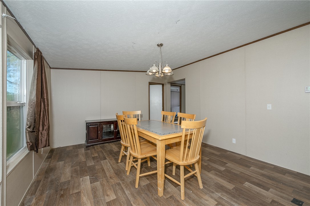 604 Sanders Rd. Lane Franklin, TX 77856 - Photo 15 of 42 a view of a dining room with furniture wooden floor and chandelier