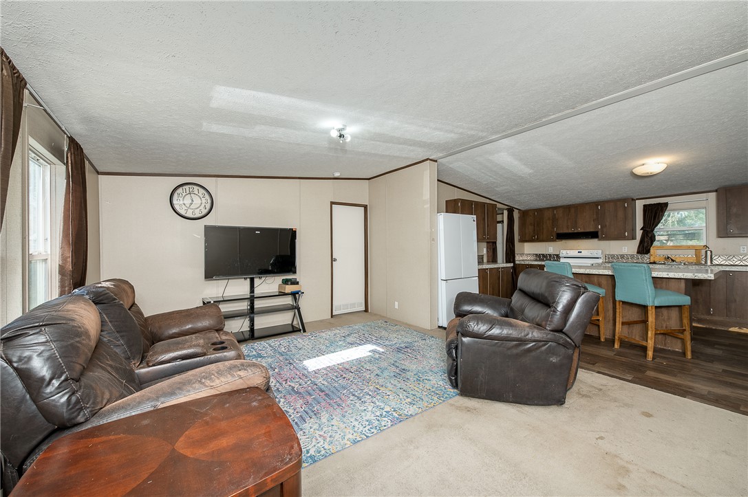 604 Sanders Rd. Lane Franklin, TX 77856 - Photo 19 of 42 a living room with furniture and a flat screen tv
