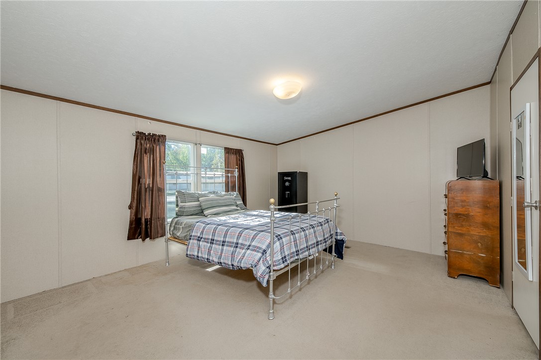 604 Sanders Rd. Lane Franklin, TX 77856 - Photo 19 of 49 Bedroom with ornamental molding and carpet floors