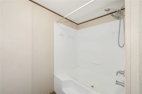 a bathroom with a granite countertop sink toilet and mirror